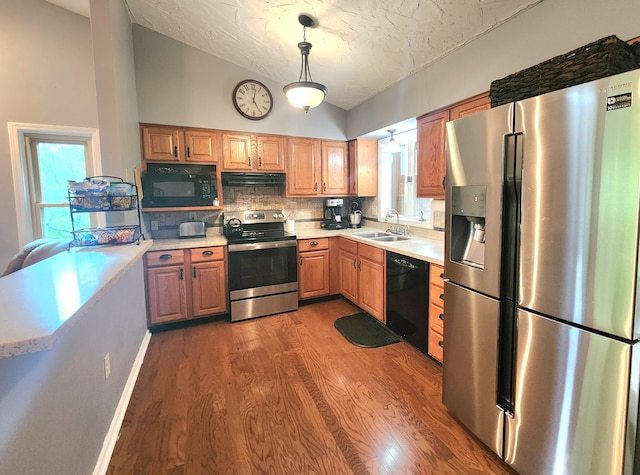 7167 Bent Mountain Rd, Roanoke, VA 24018 - kitchen featuring wood finished floors, light countertops, black appliances, a sink, and lofted ceiling