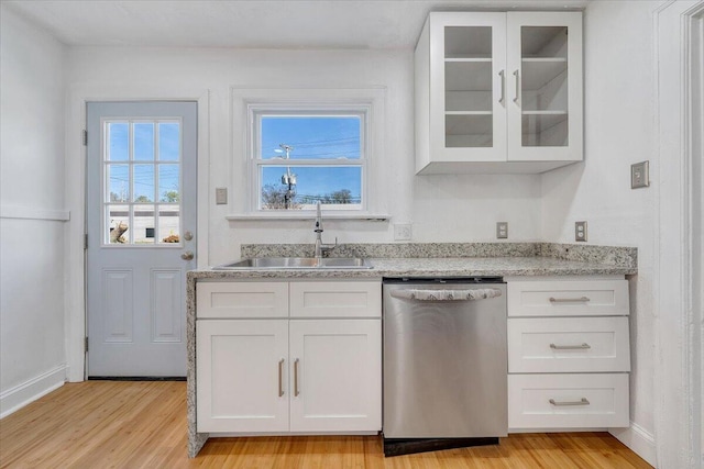 821 Kerns Ave SW, Roanoke, VA 24015 - kitchen featuring dishwasher, light wood-type flooring, and white cabinets