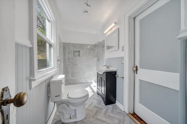 821 Kerns Ave SW, Roanoke, VA 24015 - bathroom with tiled shower, vanity, and wainscoting