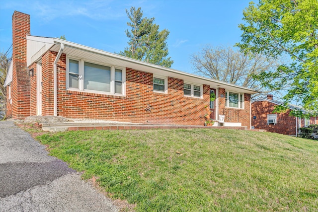4731 Peach Tree Dr NW, Roanoke, VA 24017 - view of front of home with a chimney, brick siding, and a front yard