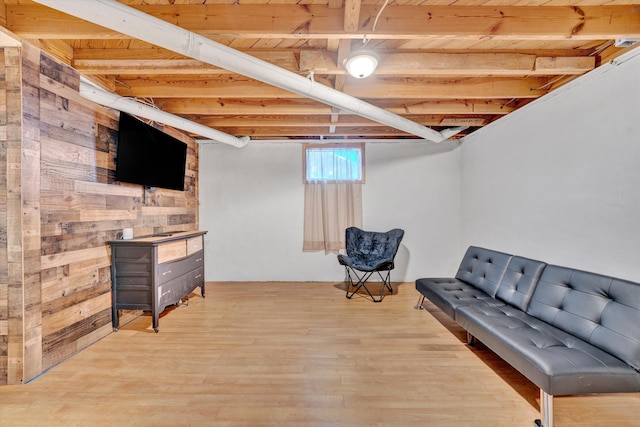 basement with wooden ceiling and wood finished floors