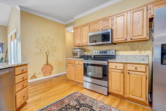 kitchen featuring light stone countertops, stainless steel appliances, light wood-style flooring, and light brown cabinets