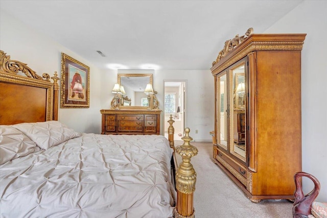 bedroom featuring carpet flooring and visible vents