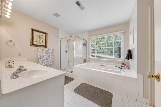 bathroom with a sink, a stall shower, a bath, and visible vents