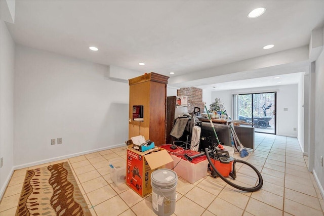 interior space featuring baseboards, recessed lighting, and light tile patterned flooring