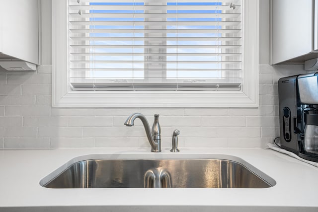 1042 Round Meadow Dr, Christiansburg, VA 24073 - kitchen view of a sink, backsplash, and light countertops