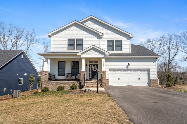 1042 Round Meadow Dr, Christiansburg, VA 24073 - craftsman house with a porch, central air condition unit, asphalt driveway, and a front lawn