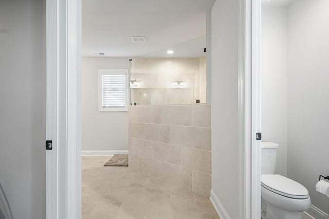 1042 Round Meadow Dr, Christiansburg, VA 24073 - bathroom with walk in shower, recessed lighting, toilet, baseboards, and tile patterned floors