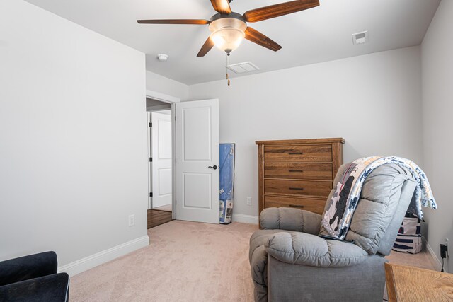 1042 Round Meadow Dr, Christiansburg, VA 24073 - living area featuring light carpet, ceiling fan, and baseboards
