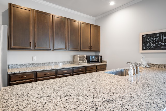 1042 Round Meadow Dr, Christiansburg, VA 24073 - kitchen featuring a sink, light stone countertops, dark brown cabinets, and ornamental molding