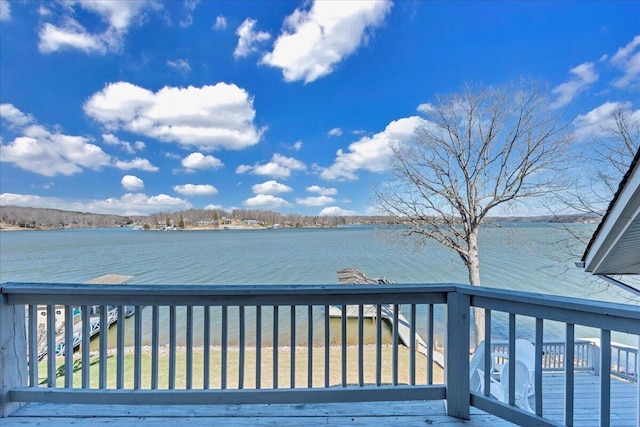 wooden deck featuring a water view