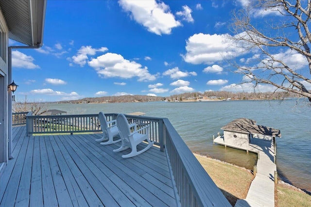 wooden deck featuring a water view