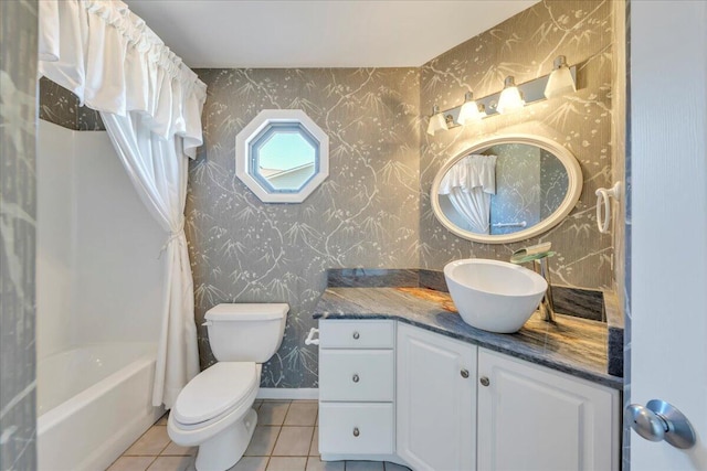 full bathroom with tile patterned flooring, wallpapered walls, baseboards, toilet, and vanity