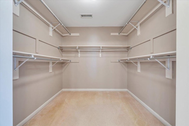 spacious closet with visible vents and carpet