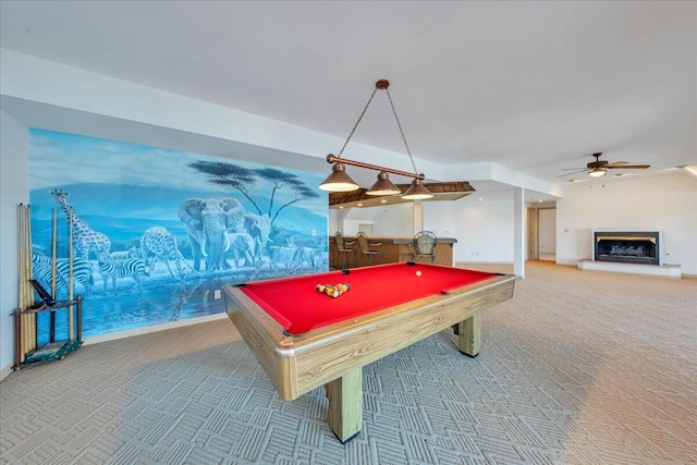 recreation room featuring a glass covered fireplace, pool table, carpet, and ceiling fan