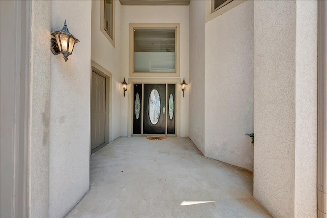 property entrance with stucco siding