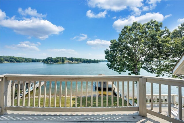 wooden terrace featuring a water view