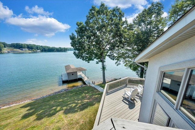 dock area featuring a yard and a water view