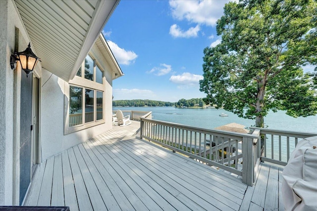 deck featuring a water view