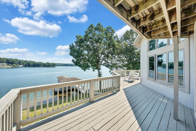 wooden deck with a water view