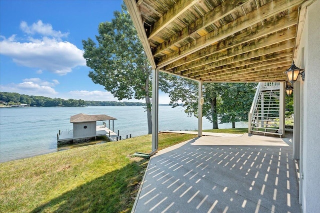 view of patio with a water view, a boat dock, and stairs