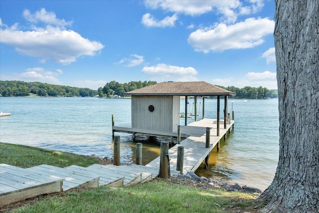 view of dock featuring boat lift and a water view