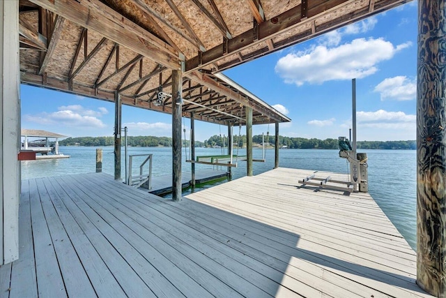 view of dock featuring boat lift and a water view