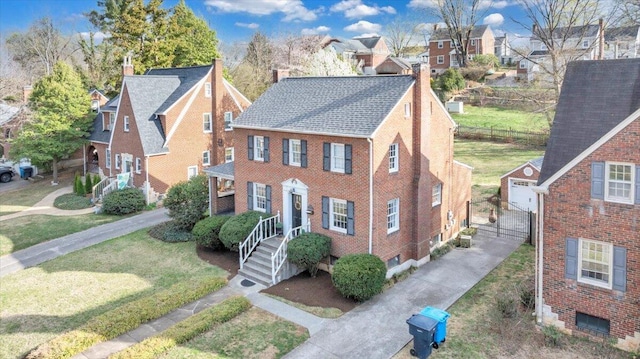 1656 Brandon Ave SW, Roanoke, VA 24015 - view of front of home featuring a chimney, a residential view, a shingled roof, brick siding, and concrete driveway
