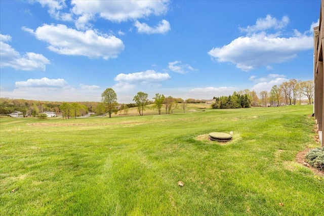 view of yard with a rural view