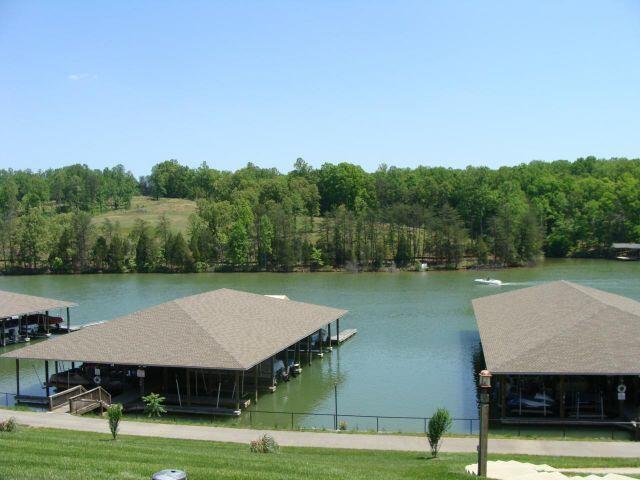 dock area featuring a forest view and a water view