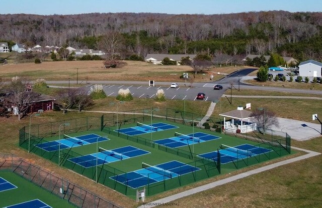 birds eye view of property with a view of trees
