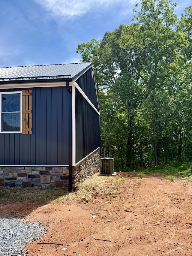1484 White House Rd, Moneta, VA 24121 - view of side of property with central air condition unit, metal roof, and stone siding