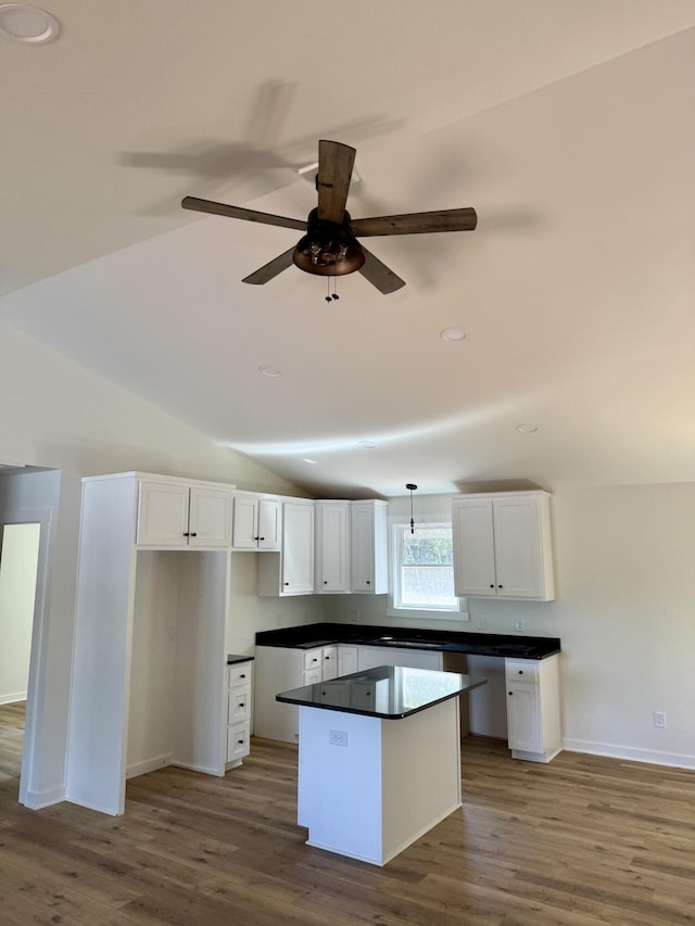 1484 White House Rd, Moneta, VA 24121 - kitchen featuring a kitchen island, wood finished floors, white cabinetry, baseboards, and ceiling fan