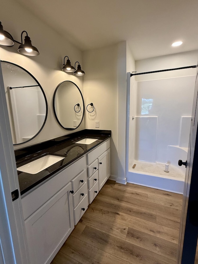 1484 White House Rd, Moneta, VA 24121 - bathroom with wood finished floors, double vanity, and a shower