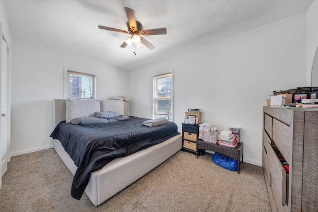728 Jamison Ave SE, Roanoke, VA 24013 - bedroom with multiple windows, baseboards, carpet, and a ceiling fan