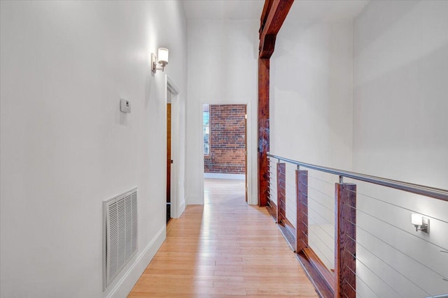 133 Norfolk Ave SW, Roanoke, VA 24011 - hall with light wood-style flooring, beam ceiling, a high ceiling, and baseboards