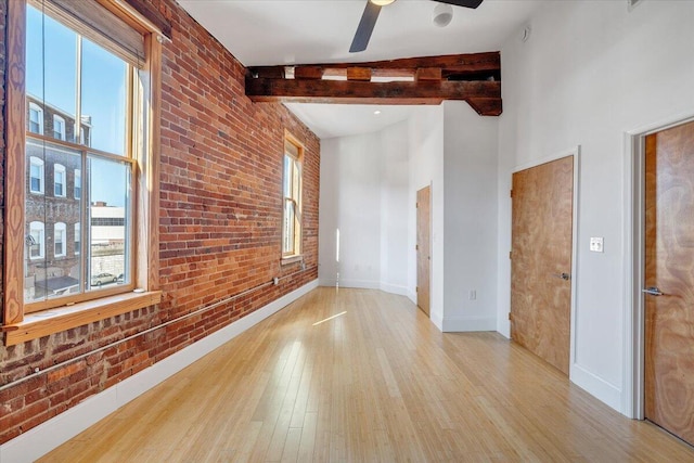 133 Norfolk Ave SW, Roanoke, VA 24011 - unfurnished room featuring healthy amount of natural light, wood finished floors, beam ceiling, ceiling fan, and baseboards