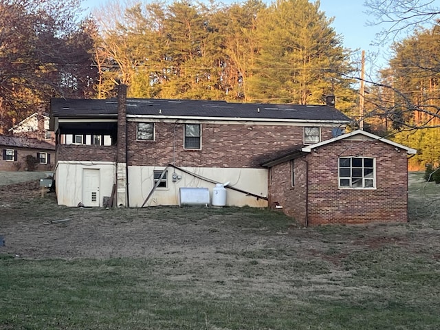 451 Grand Lake Dr, Ridgeway, VA 24148 - back of house with a yard and brick siding