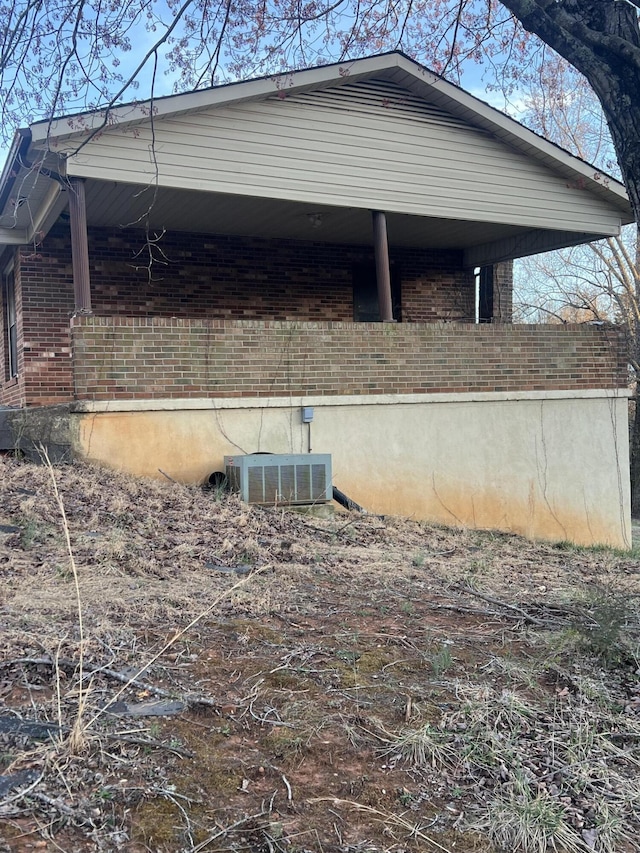 451 Grand Lake Dr, Ridgeway, VA 24148 - view of home's exterior featuring brick siding and central AC unit