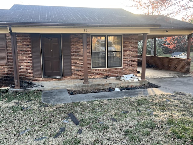 451 Grand Lake Dr, Ridgeway, VA 24148 - view of exterior entry featuring a carport and brick siding