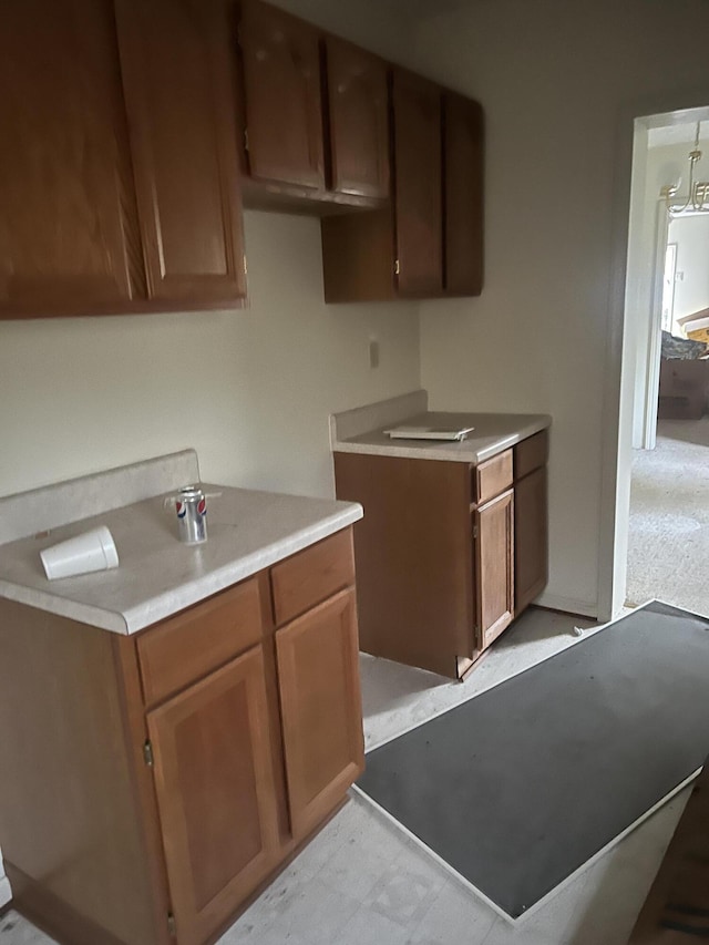 451 Grand Lake Dr, Ridgeway, VA 24148 - kitchen featuring brown cabinetry, light floors, and light countertops