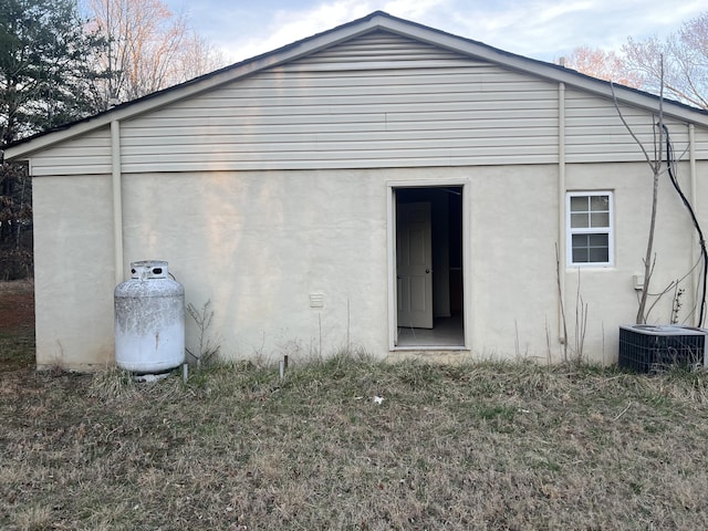 451 Grand Lake Dr, Ridgeway, VA 24148 - back of property featuring central AC unit and stucco siding