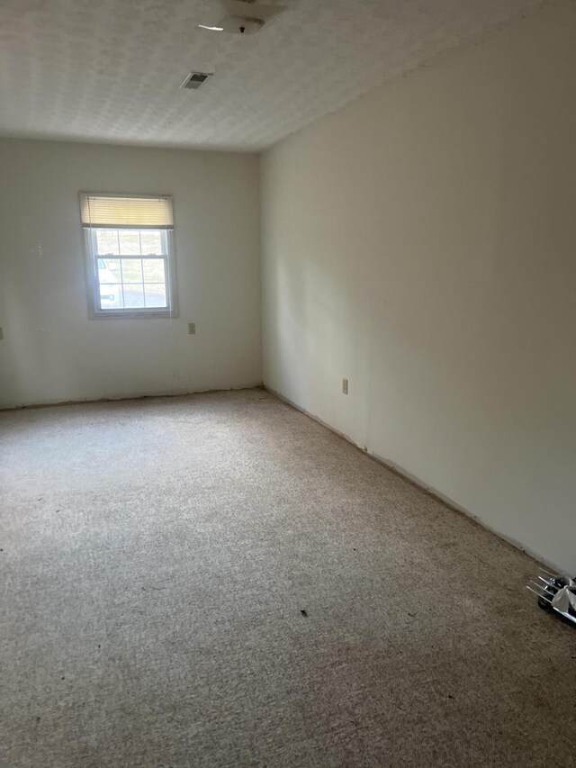 451 Grand Lake Dr, Ridgeway, VA 24148 - empty room featuring carpet flooring, a textured ceiling, and visible vents