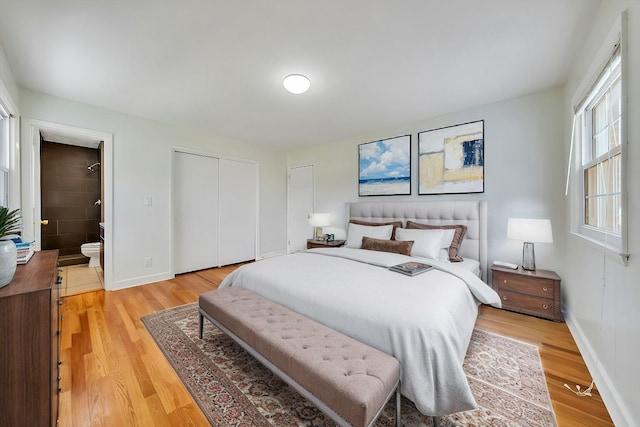 1401 Grove Dr, Pulaski, VA 24301 - bedroom featuring ensuite bath, light wood-style flooring, a closet, and baseboards