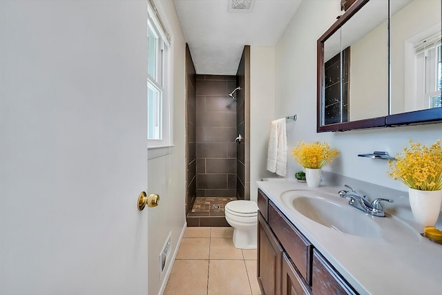 1401 Grove Dr, Pulaski, VA 24301 - bathroom with tile patterned flooring, visible vents, toilet, vanity, and tiled shower