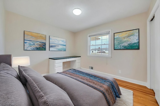 1401 Grove Dr, Pulaski, VA 24301 - bedroom with baseboards, visible vents, and light wood-type flooring