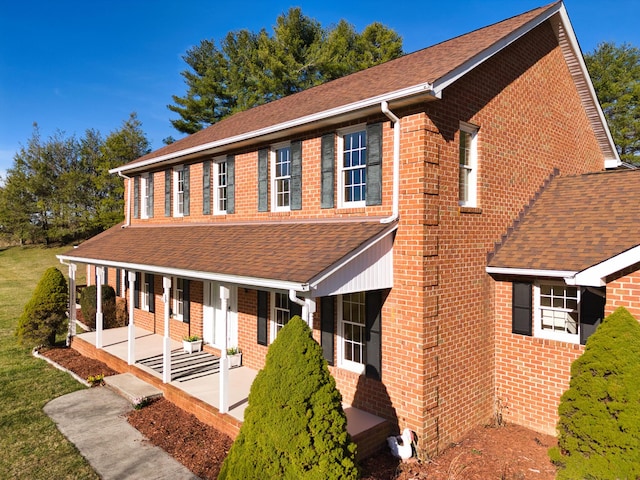 195 Showalter Rd NW, Willis, VA 24380 - view of front facade featuring roof with shingles, covered porch, and brick siding
