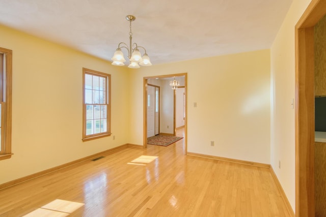 195 Showalter Rd NW, Willis, VA 24380 - spare room with a chandelier and light wood-style flooring