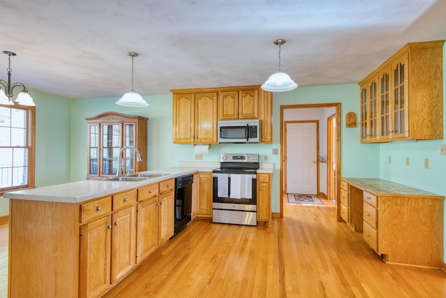 195 Showalter Rd NW, Willis, VA 24380 - kitchen featuring stainless steel appliances, a peninsula, light wood-style flooring, and light countertops