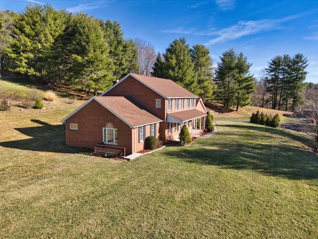 195 Showalter Rd NW, Willis, VA 24380 - view of front of home with brick siding, a front lawn, and view of scattered trees